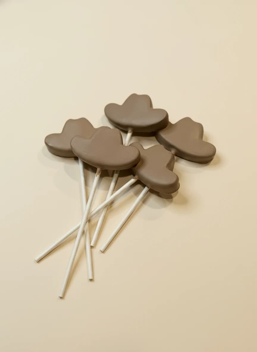 Bite-sized cake pops arranged for an event spread.