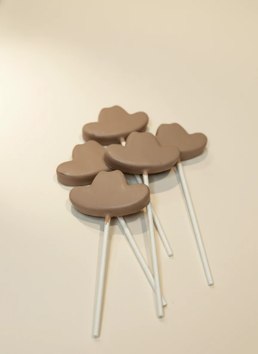 Cowboy-hat-shaped chocolate cake pops.