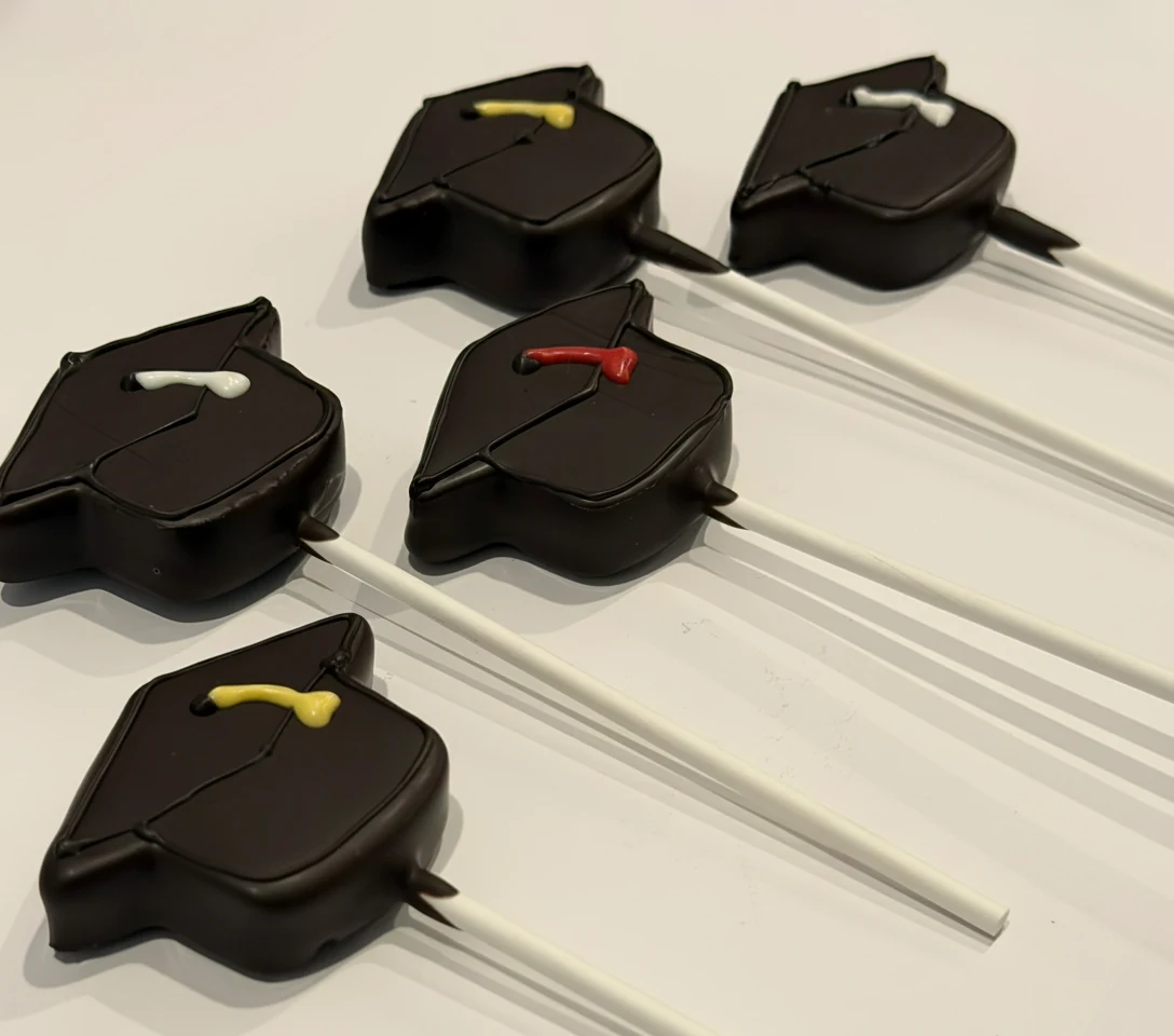 Custom themed cake pops by Lotus Sweet Treats.